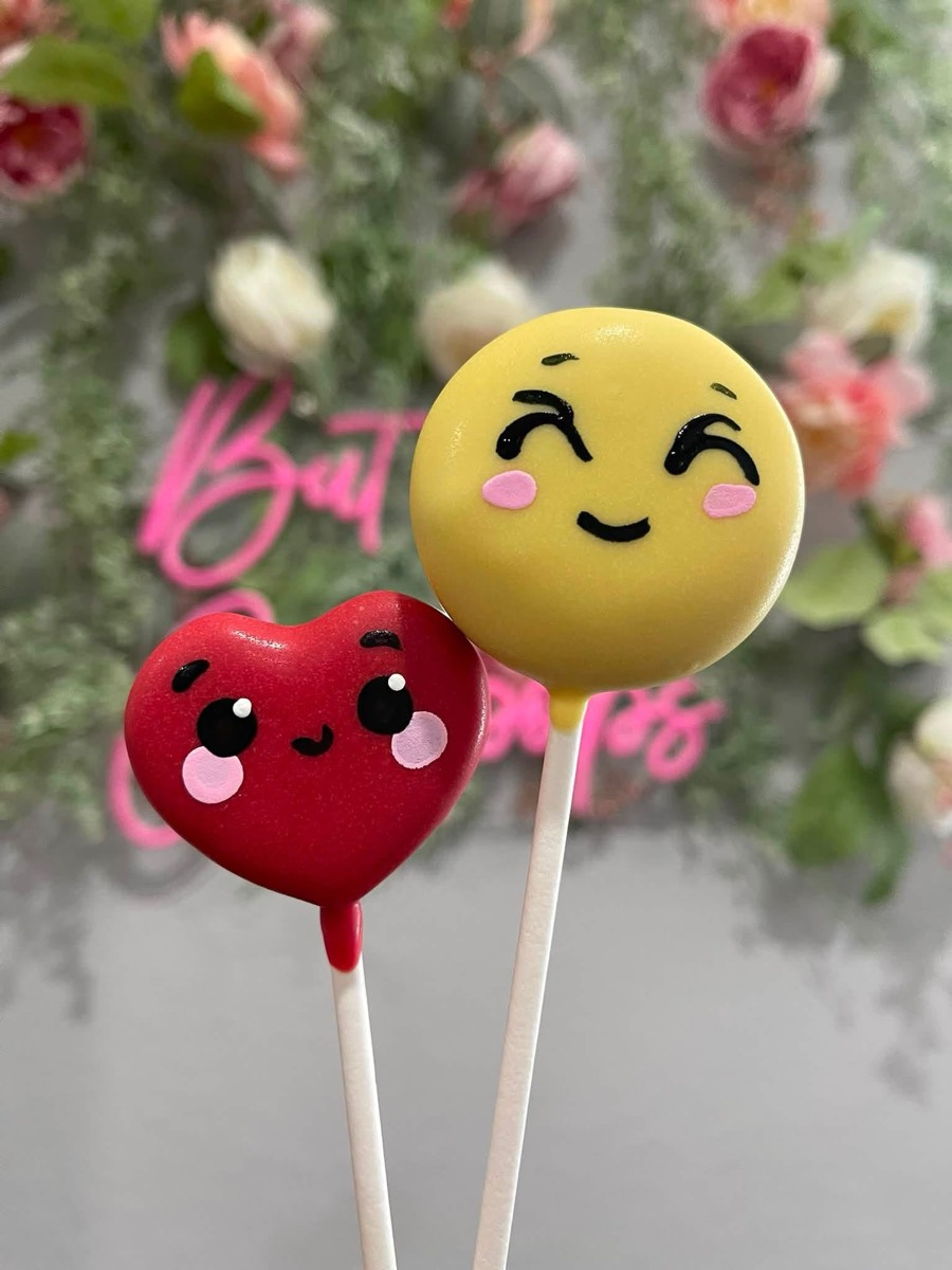 Smiley-face and heart emoji cake pops