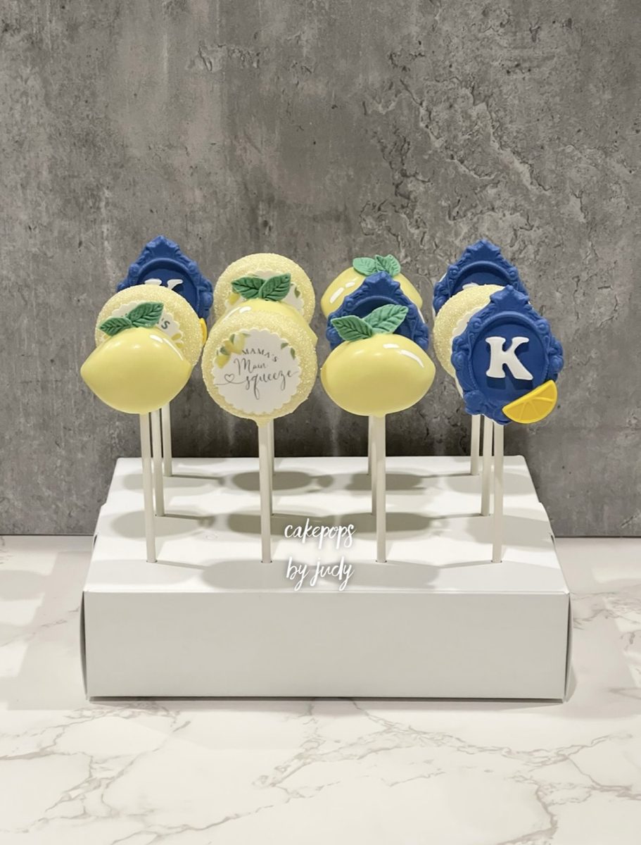 Lemon and monogram cake pops with an edible image label