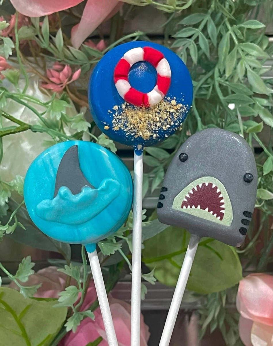 Shark, life-preserver and beach-theme cake pops